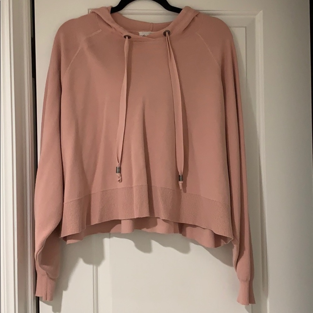 Light pink colored short hoodie